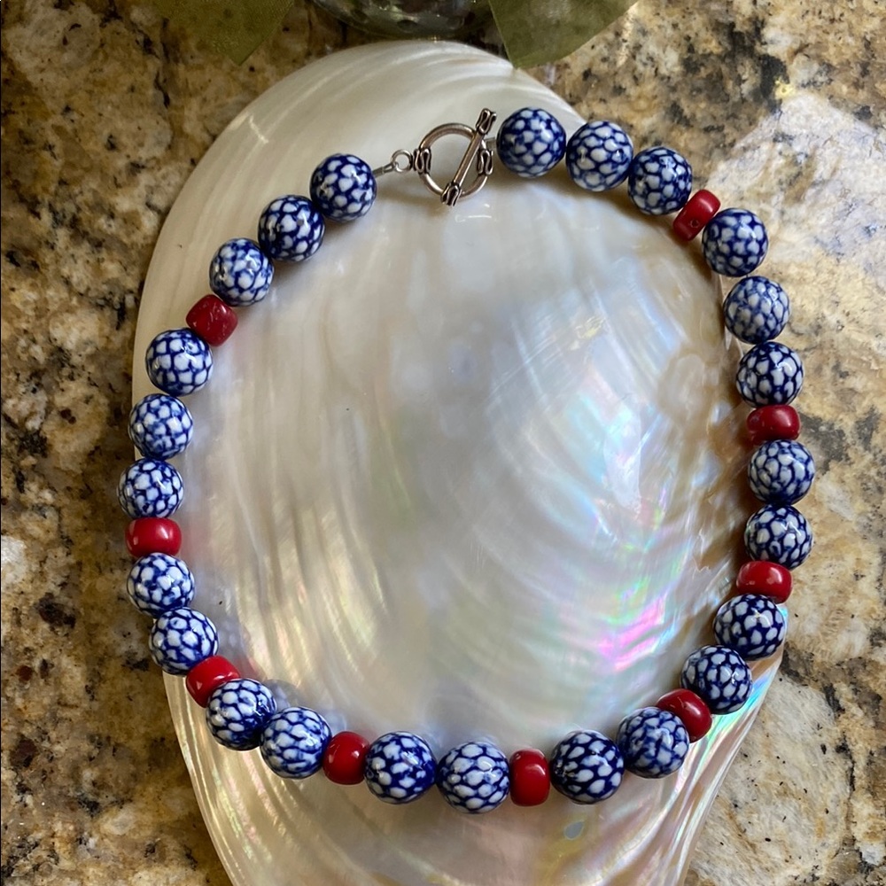 Gorgeous ceramic blue and white beads with red coral spacers.